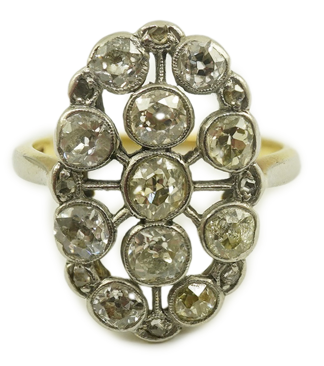 A 1940's 18ct gold, platinum and millegrain set diamond oval cluster ring